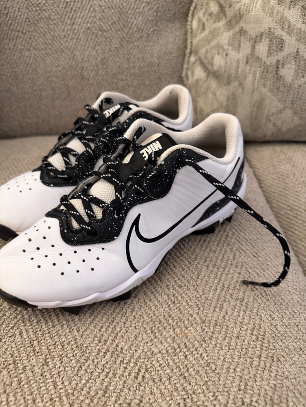 Nike White and Black Sport Cleats with Speckled Accents